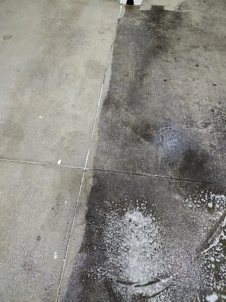 Removing oil stains from concrete with pressure washing